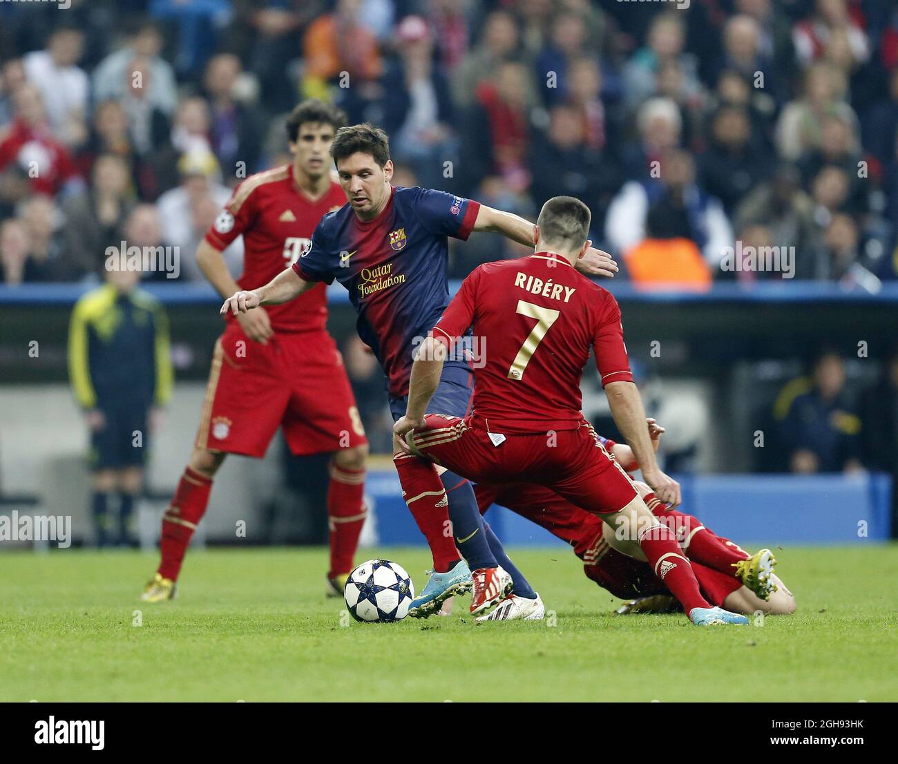 Munich's Franck Ribery tussles with Barcelona's Lionel Messi during the  League Cup Semi Final 1st Leg match between Bayern Munich and Barcelona at  the Allianz Arena in Munich on April 23, 2013.
