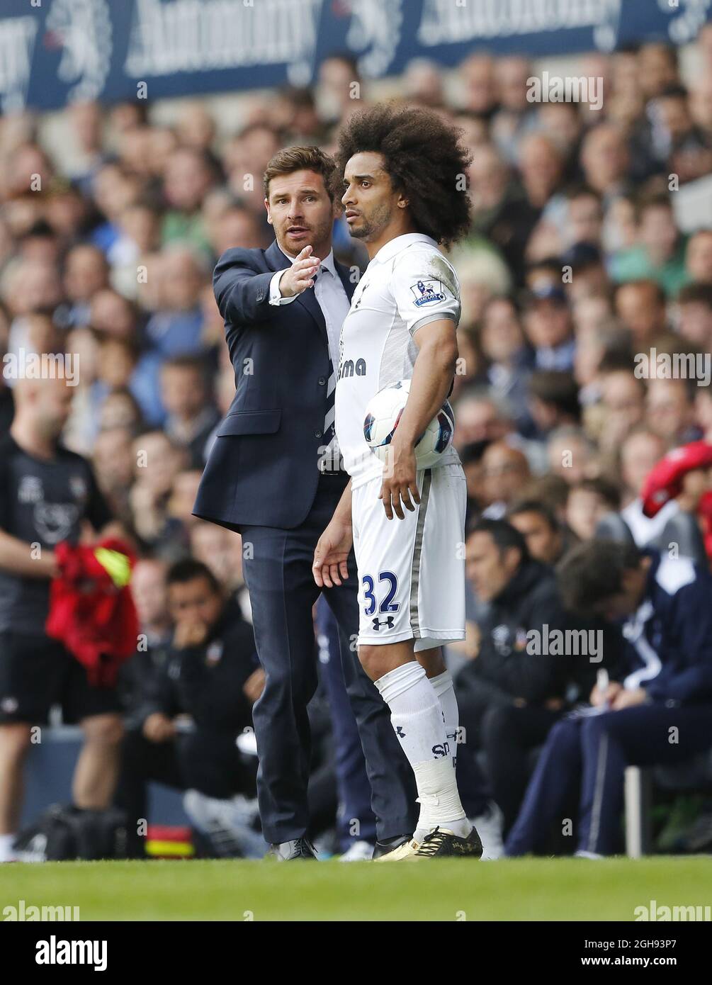 Tottenham's Andre Villas-Boas chats with Benoit Assou-Ekotto during the Barclays Premier League match between Tottenham Hotspur and Southampton in White Hart Lane, London on April 21, 2013. Picture David Klein Stock Photo