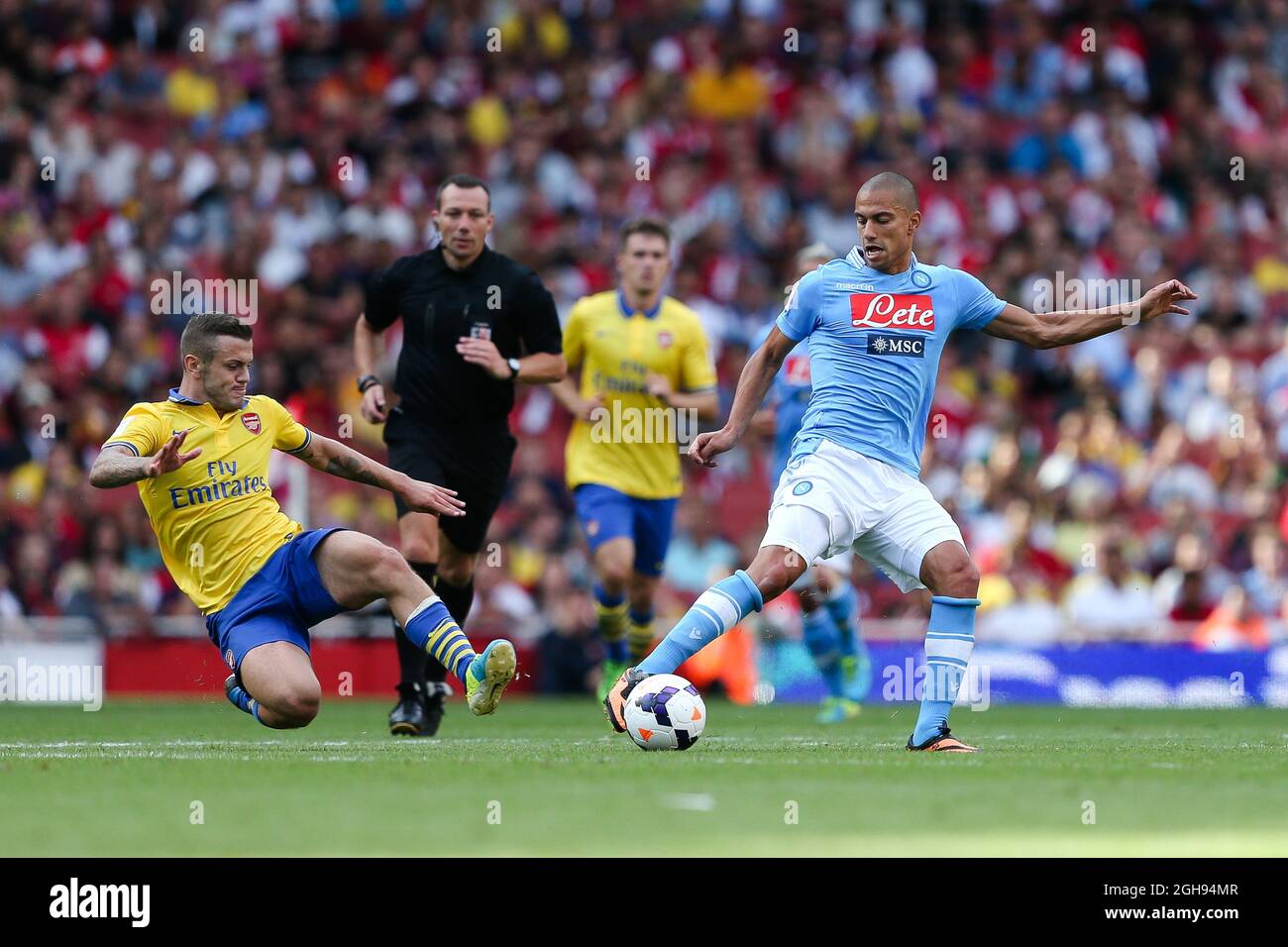 Jack Wilshere of Arsenal goes in on Napoli's Gokhan Inler during the Emirates Cup 2013 between Arsenal and Napoli at the Emirates Stadium in London on August 03, 2013. Stock Photo