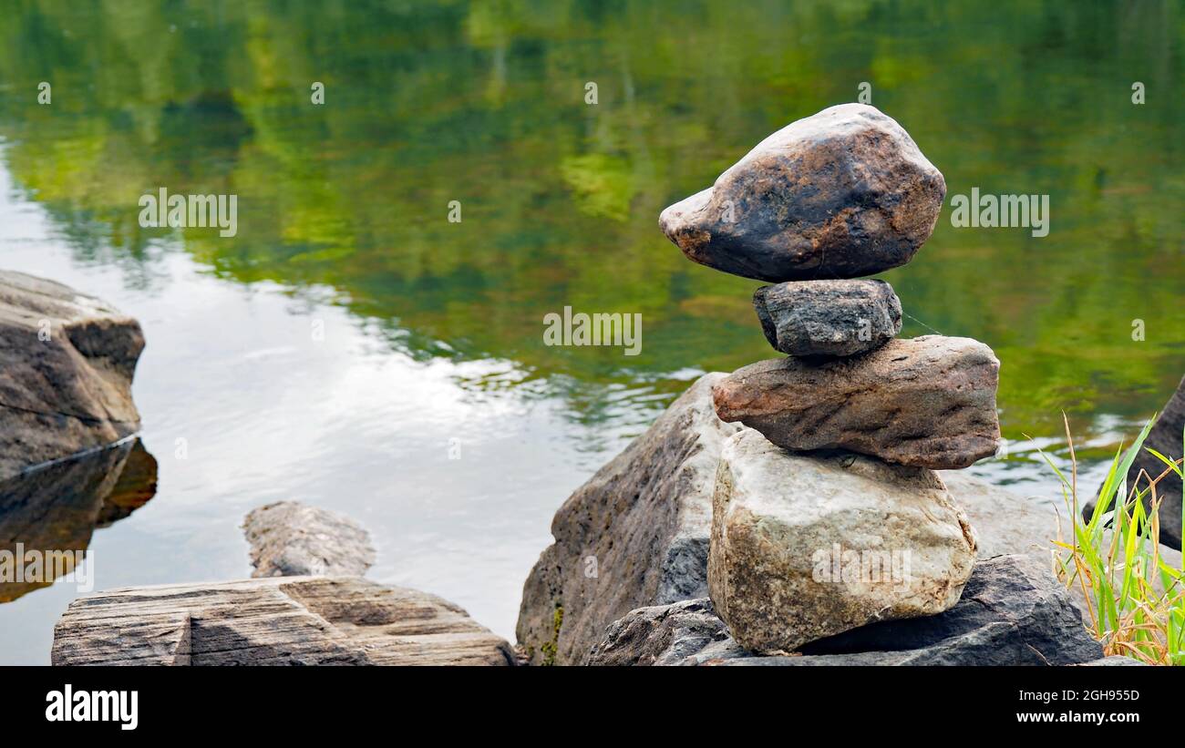 OLYMPUS DIGITAL CAMERA - Close-up of a rock cairns built on the edge of the Madawaska River in Calabogie, Ontario, Canada. Stock Photo