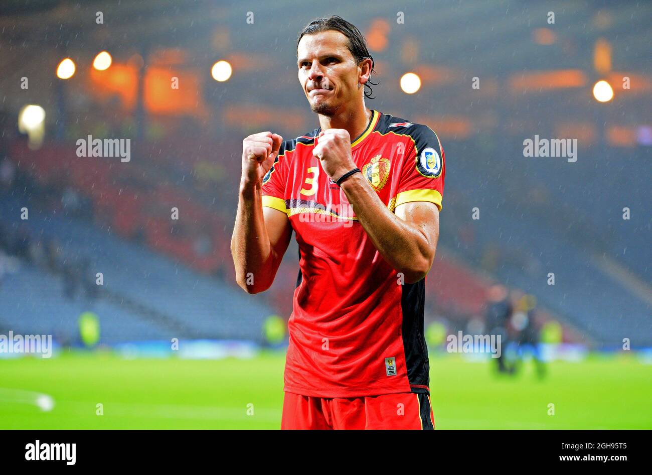 Daniel van Buyten of Belgium celebrates the win with the fans during the 2014 FIFA World Cup Qualifying, Group A match between Scotland and Belgium at the Hampden Park Stadium in Glasgow, Scotland on September 6, 2013. Stock Photo
