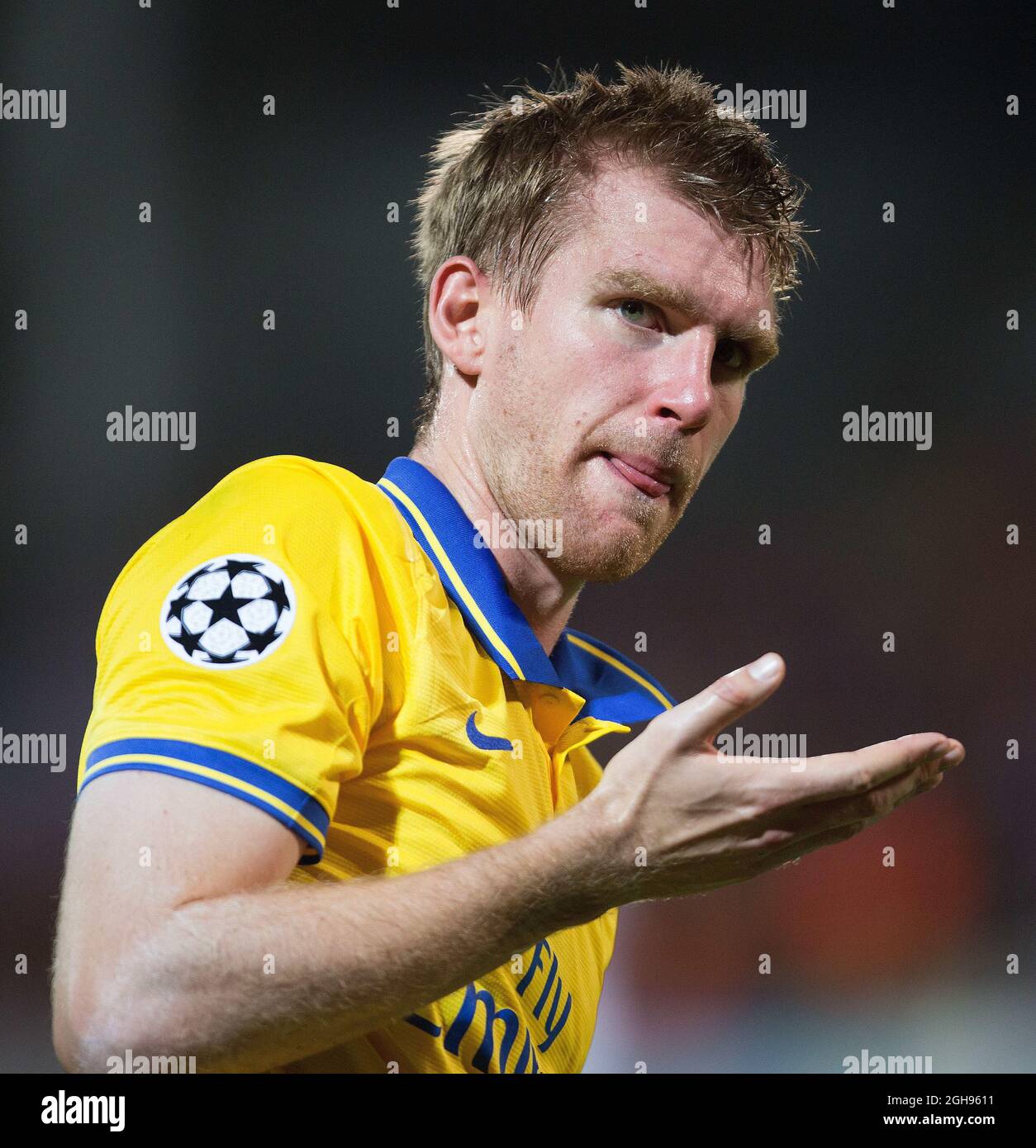Arsenal's Per Mertesacker reacts during the UEFA Champions League Group F match between Olympique de Marseille and Arsenal FC at Stade Velodrome Stadium in Marseille, France, on Sept. 18, 2013. Stock Photo
