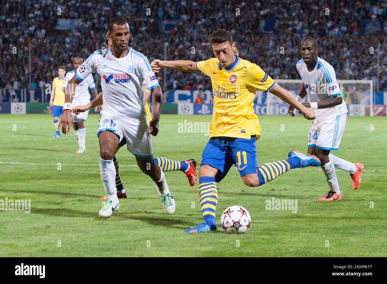 Arsenal's Mesut Ozil strikes at goal during the UEFA Champions&#8217; League Group F match between Olympique de Marseille and Arsenal FC at Stade Velodrome Stadium in Marseille, France, on Sept. 18, 2013. Stock Photo
