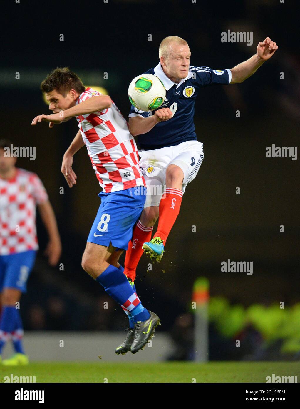 Ognjen Vukojevic of Croatia tussles with Steven Naismith of Scotland during their FIFA World Cup 2014 qualifier soccer match between Scotland and Croatia at the Hampden Park Stadium in Glasgow, United Kingdom , Oct. 15, 2013. Picture Simon Bellis Stock Photo