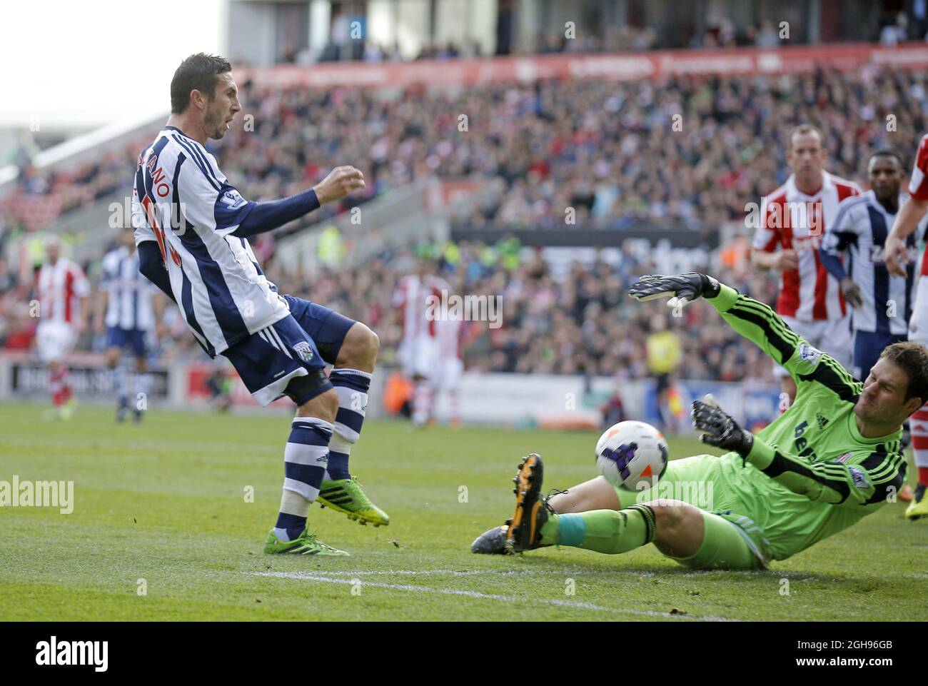 Morgan Amalfitano of West Bromwich brings a point blank save from Stoke goalkeeper Asmir Begovic during the Barclays Premier League Football match between Stoke City and West Bromwich Albion held at Britannia Stadium in Stoke, UK on 19th October 2013. Photo by: Malcolm Couzens. Stock Photo
