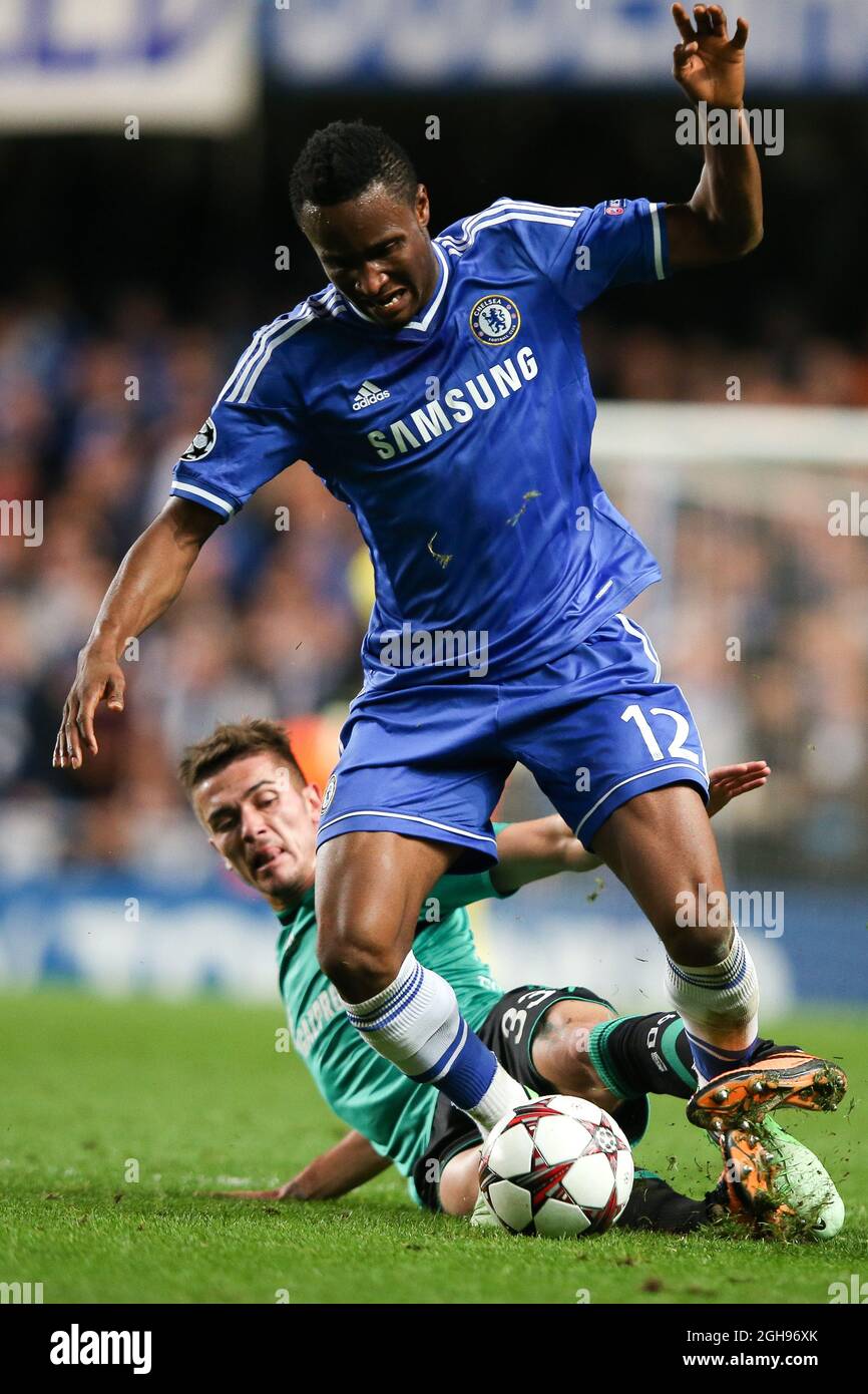John Mikel Obi of Chelsea and FC Shalke's Roman Neust during the Champions League group E soccer match between Chelsea and FC Schalke 04 at Stamford Bridge Stadium in London on November 6, 2013. Stock Photo