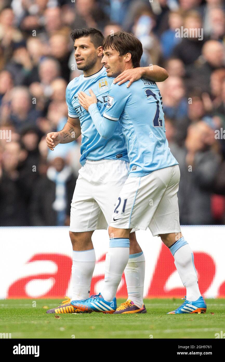 Sergio Aguero of Manchester City celebrates with David Silva during the Barclays Premier League match between Manchester City and Norwich City held at the Etihad Stadium in Manchester, UK on Nov. 2, 2013. Photo by: Phillip Oldham. Stock Photo