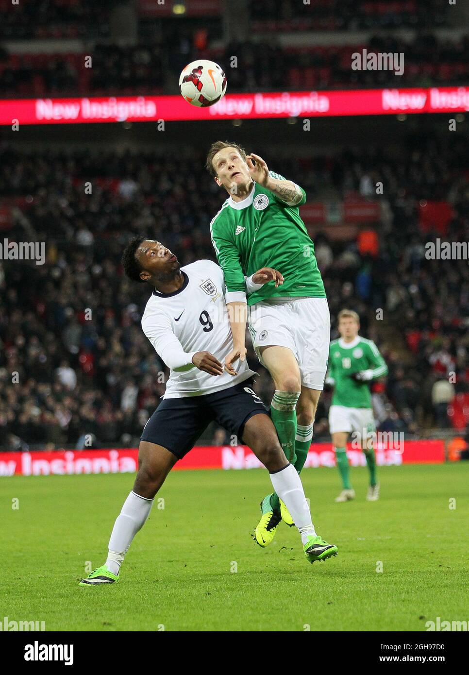 England's Daniel Sturridge tussles with Germany's Marcell Jansen during the International Friendly match between England and Germany held at the Wembley Stadium in London on Nov. 19, 2013. Stock Photo