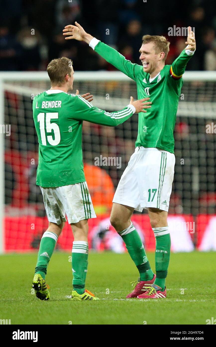Germany's goalscorer and captain Per Mertesacker celebrates the victory with Germany's Lars Bender during the International Friendly match between England and Germany held at the Wembley Stadium in London on Nov. 19, 2013. Stock Photo