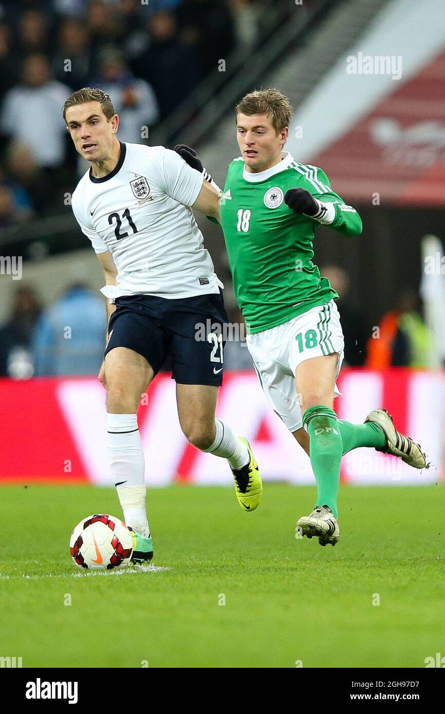 England's Rickie Lambert and Germany's Toni Kroos in action during the International Friendly match between England and Germany held at the Wembley Stadium in London on Nov. 19, 2013. Stock Photo