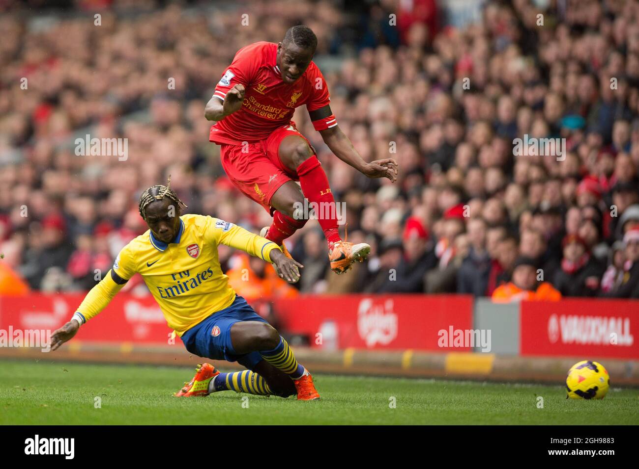Arsenal's Bacary Sagna challenges Aly Cissokho of Liverpool during the Barclays Premier League match between Liverpool and Arsenal at Anfield, Liverpool on February 08, 2014. Stock Photo