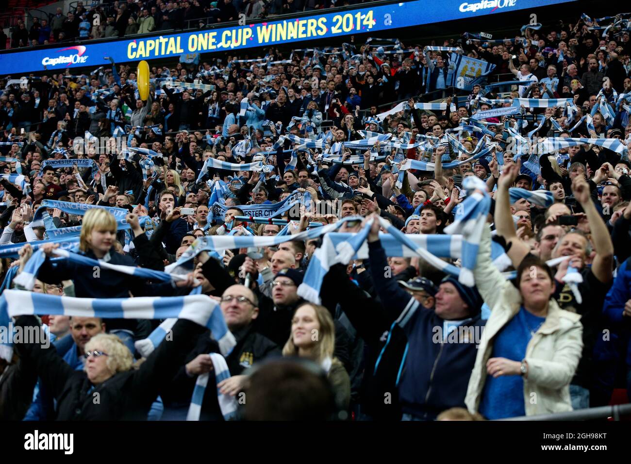 Manchester City fans hold up their scarves the League Cup Final match  between Manchester City and Sunderland at Wembley Stadium, London, UK on  March 2, 2014 Stock Photo - Alamy, image size:1300x956
