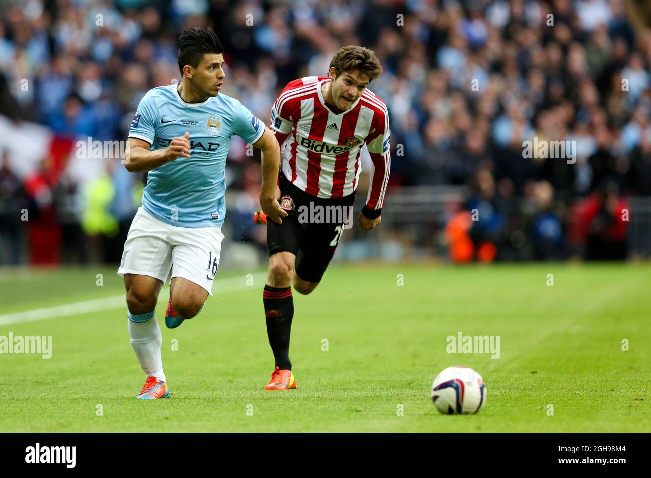 Manchester City's Sergio Aguero and Sunderland's Marcos Alonso during the League Cup Final match between Manchester City and Sunderland at Wembley Stadium, London, UK on March 2, 2014. Stock Photo