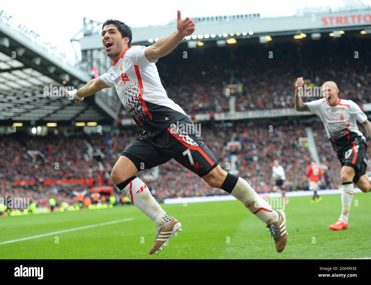 Luis Suarez of Liverpool celebrates scoring the third goal during the Barclays Premier League match between Manchester United and Liverpool held at the Old Trafford Stadium in Manchester, England on March 16, 2014. Pic Simon Bellis Stock Photo