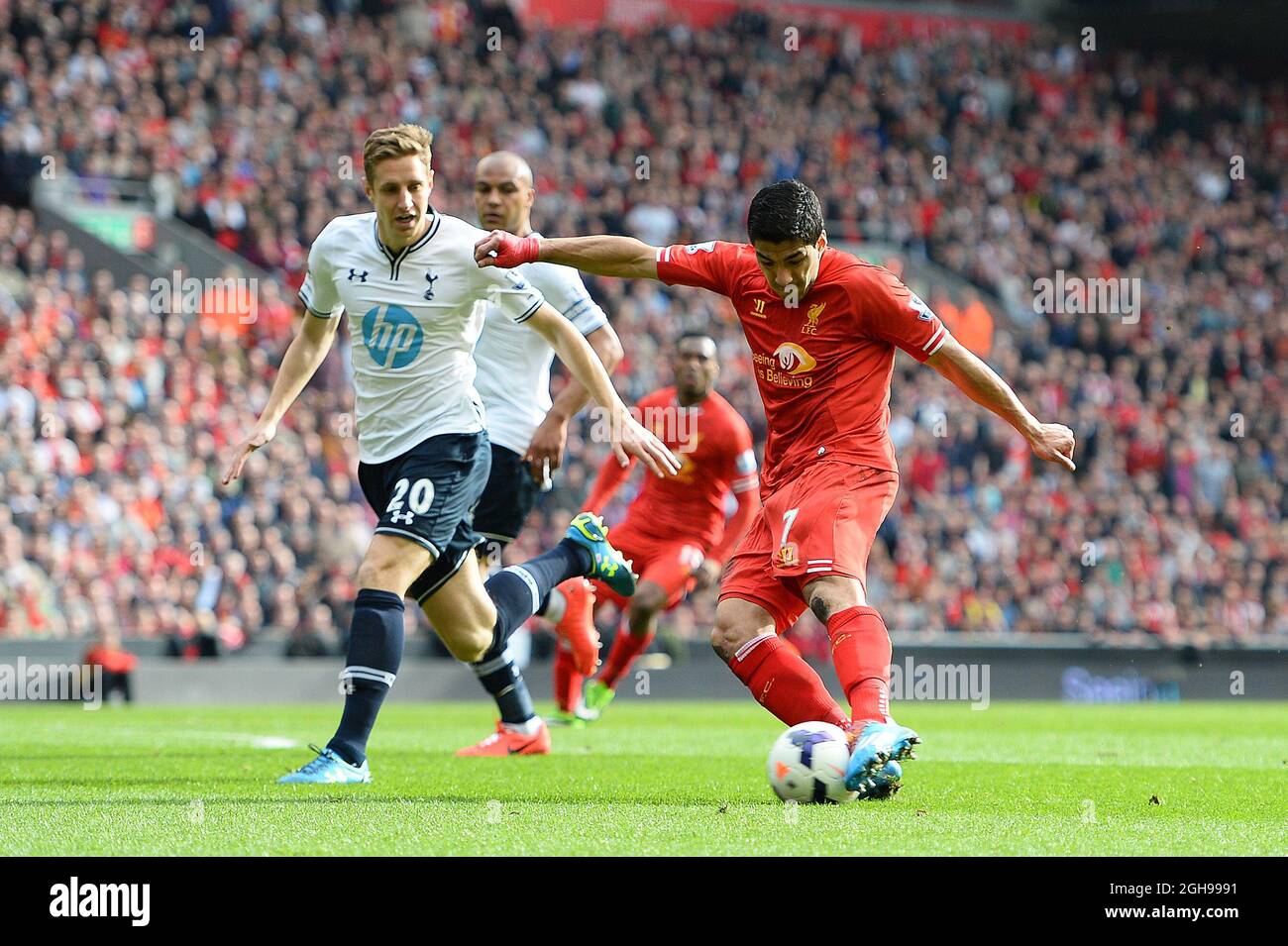 Luis Suarez of Liverpool scores the second goal during the Barclays Premier League match between Liverpool and Tottenham at the Anfield Stadium in Liverpool, England on March 30, 2014. Stock Photo