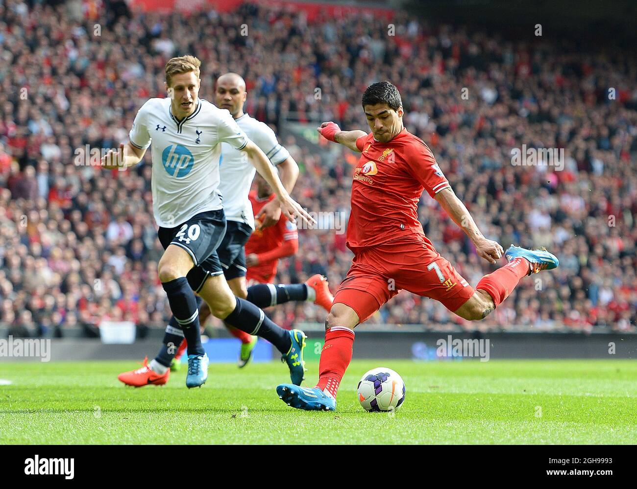 Luis Suarez of Liverpool scores the second goal during the Barclays Premier League match between Liverpool and Tottenham at the Anfield Stadium in Liverpool, England on March 30, 2014. Stock Photo