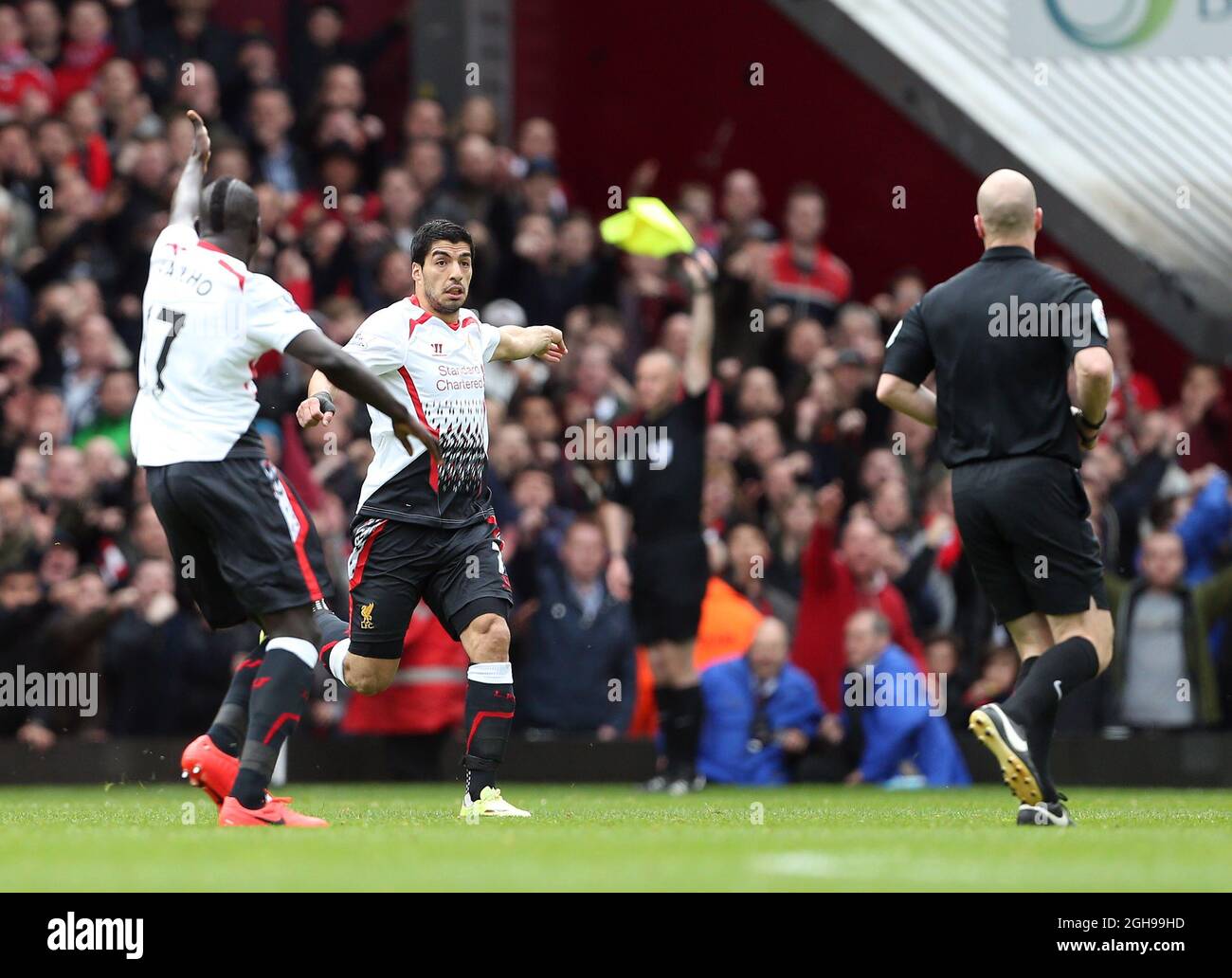 Liverpool's Luis Suarez complains about the award of West Ham's Guy Demel's goal during the Barclays Premier League match between West Ham United and Liverpool held at the Upton Park in London, England on April 6, 2014. Stock Photo