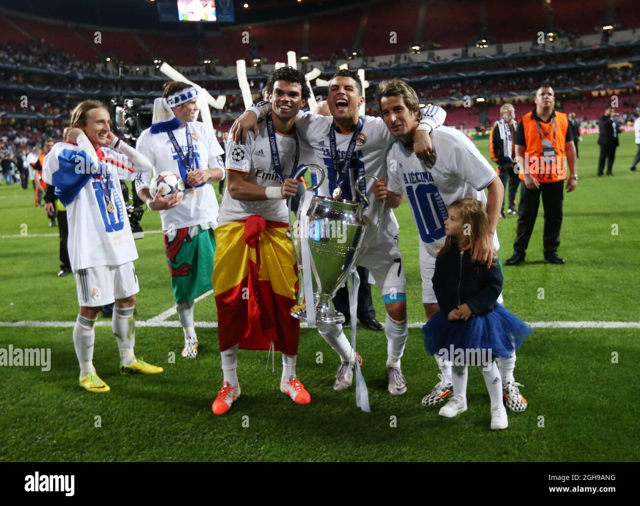 Real Madrid's Pepe, Cristiano Ronaldo and Fabio Coentrao celebrate with the trophy After the UEFA Champions League soccer final match between Real Madrid and Atletico Madrid at Estadio da Luz Stadium in Lisbon, Portugal on May 24, 2014. Pictured by David Klein/Sportimage. Stock Photo