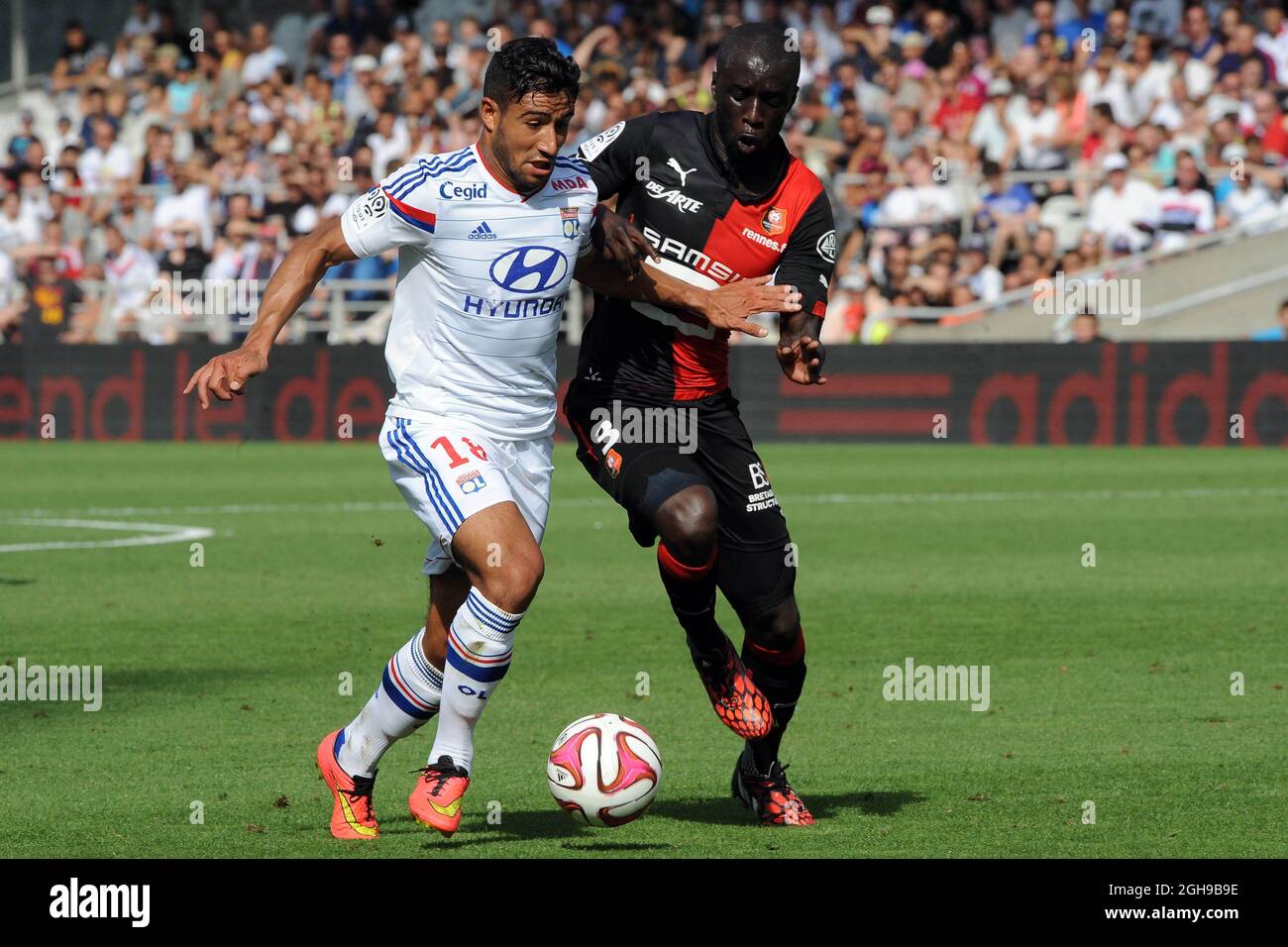 Nabil Fekir andCheikh M'Bengue in action during the French Ligue 1 soccer match between Stade Rennais F.C and Olympique Lyonnais at Stade Gerland stadium in France on August 10, 2014. Photo : Jean Paul Thomas  Icon Sport Stock Photo