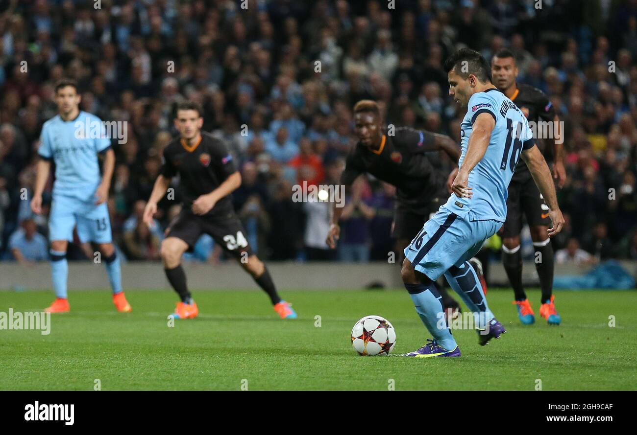 Sergio Aguero of Manchester City scores a penalty during UEFA Champions League group E match between Manchester City and Roma held at Etihad Stadium in Manchester, England on 30th September 2014. Stock Photo
