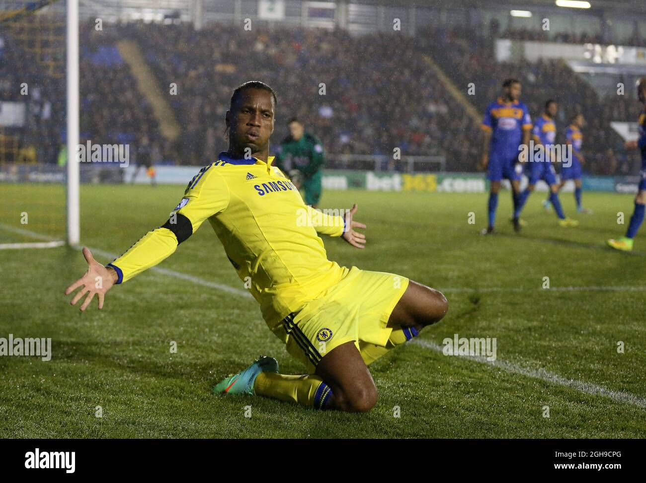 Didier Drogba of Chelsea celebrates his goal during the Capital One Cup Fourth Round match between Shrewsbury Town and Chelsea at the Greenhous Meadow Stadium, London on 28, October 2014. Stock Photo