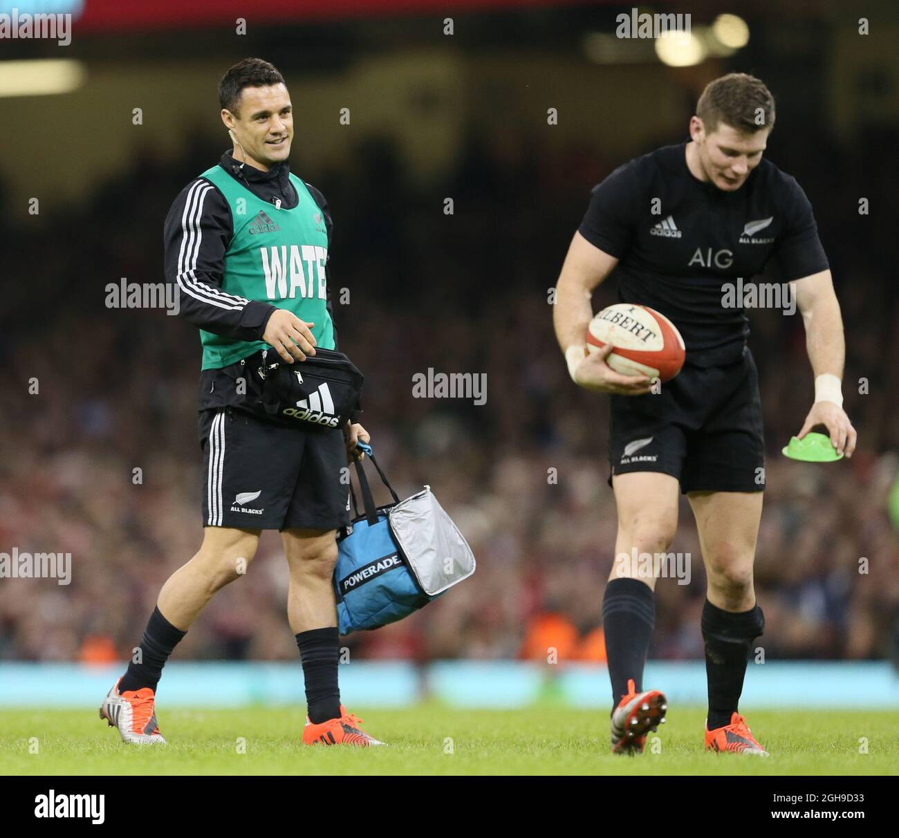 Dan Carter of New Zealand (L) the water boy for the day during the Dove Men Series match between Wales and New Zealand at the Millennium Stadium, Cardiff, wales on 22nd November 2014. Stock Photo