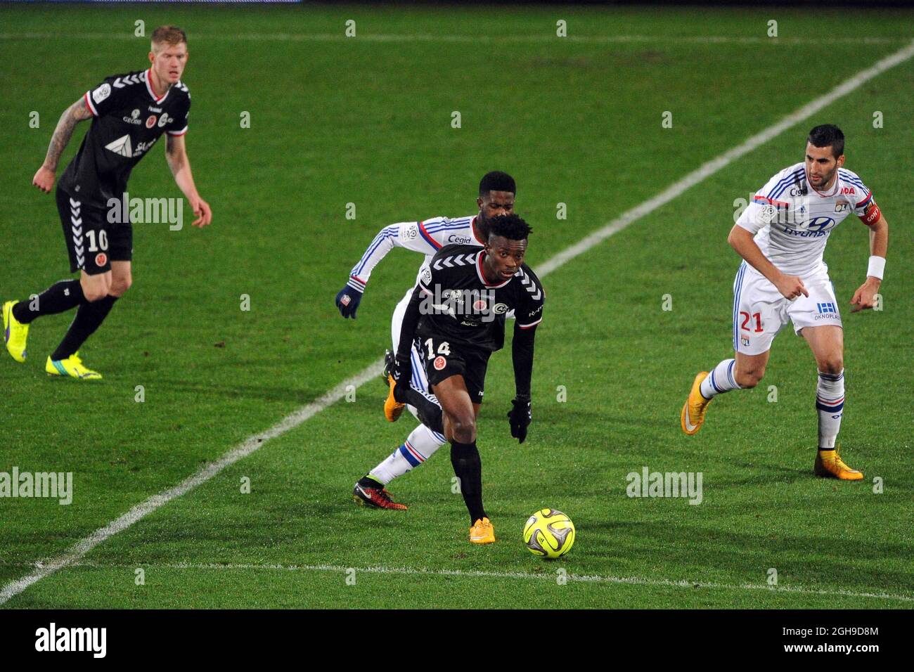 Benjamin Moukandjo in action during Ligue 1 match between Stade de Reims and Lyon at the Stade de Gerland in France on December 04, 2014. Stock Photo