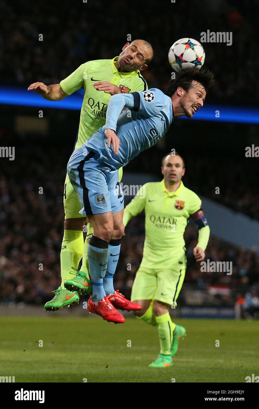 Javier Mascherano of Barcelona challenges David Silva of Manchester City during the UEFA Champions League Round of 16 match between Manchester City and Barcelona at the Etihad Stadium, London on 24th February 2015. Stock Photo
