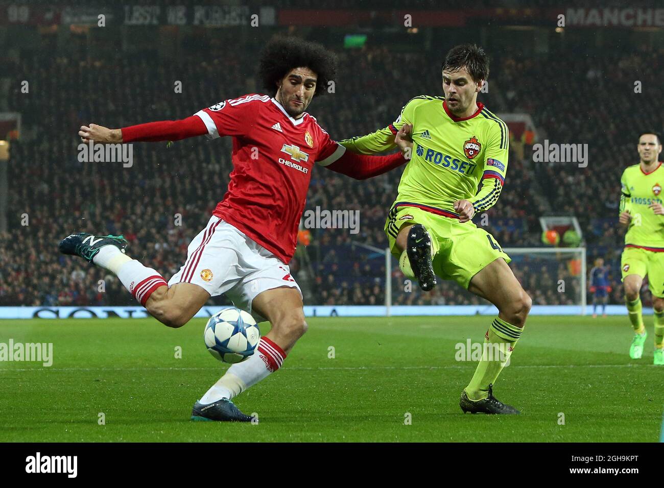 Image #: 40669984    Nov. 3, 2015 - Manchester, United Kingdom - Marouane Fellaini of Manchester United battles Georgi Schennikov of CSKA - Manchester United vs CSKA Moscow - UEFA Champion's League - Old Trafford - Manchester - 03112015. Stock Photo