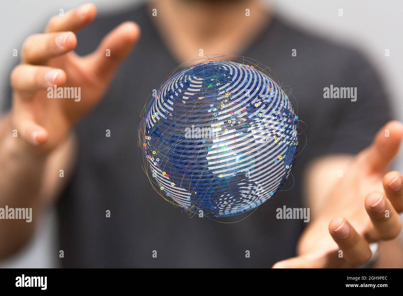 Illustrated globe in a hand of a man as a concept of world network ...
