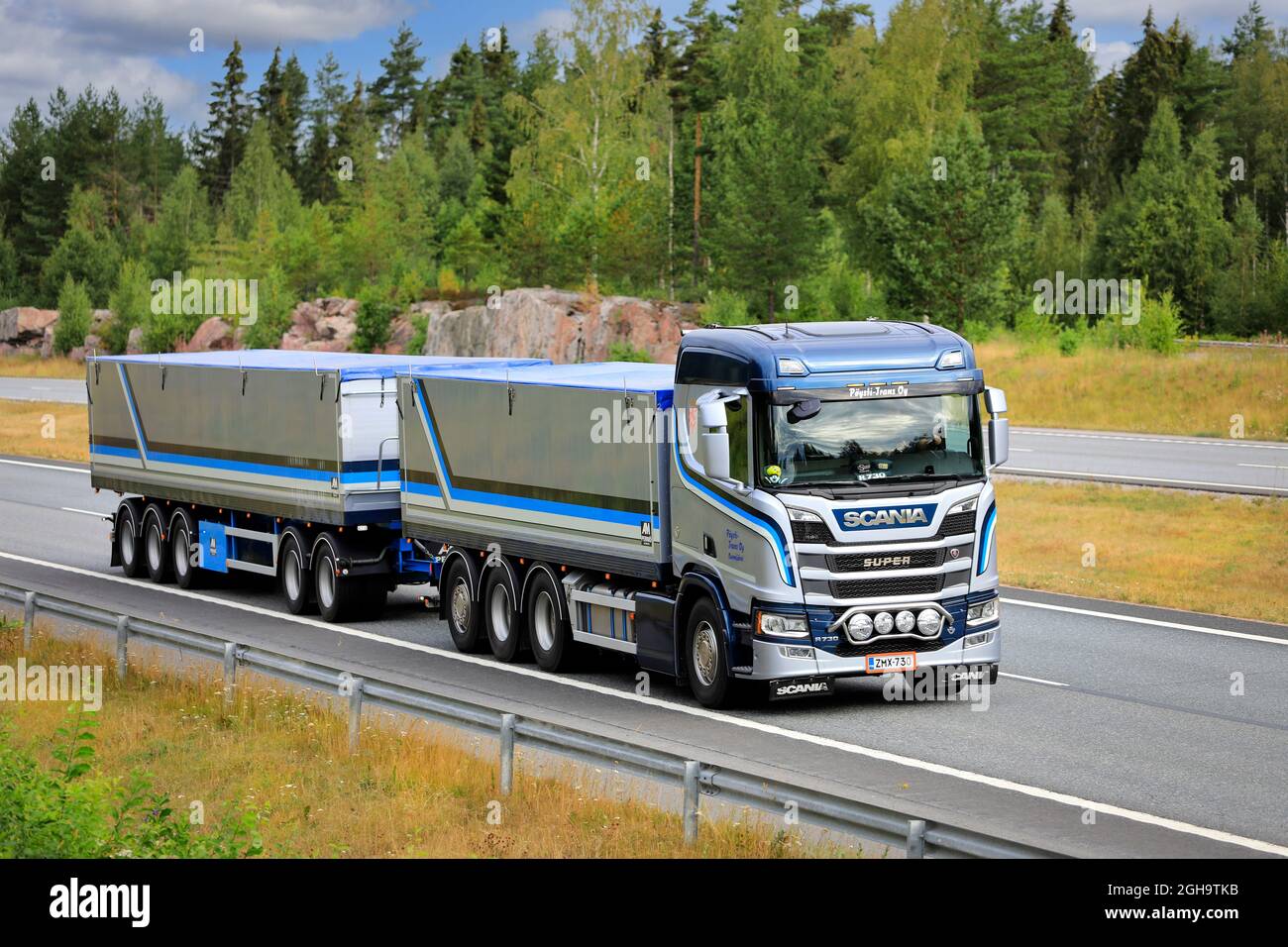 Beautifully customised Scania R730 grain truck with hopper trailer Poysti Trans at speed on motorway in the summer. Salo, Finland. July 23, 2021. Stock Photo