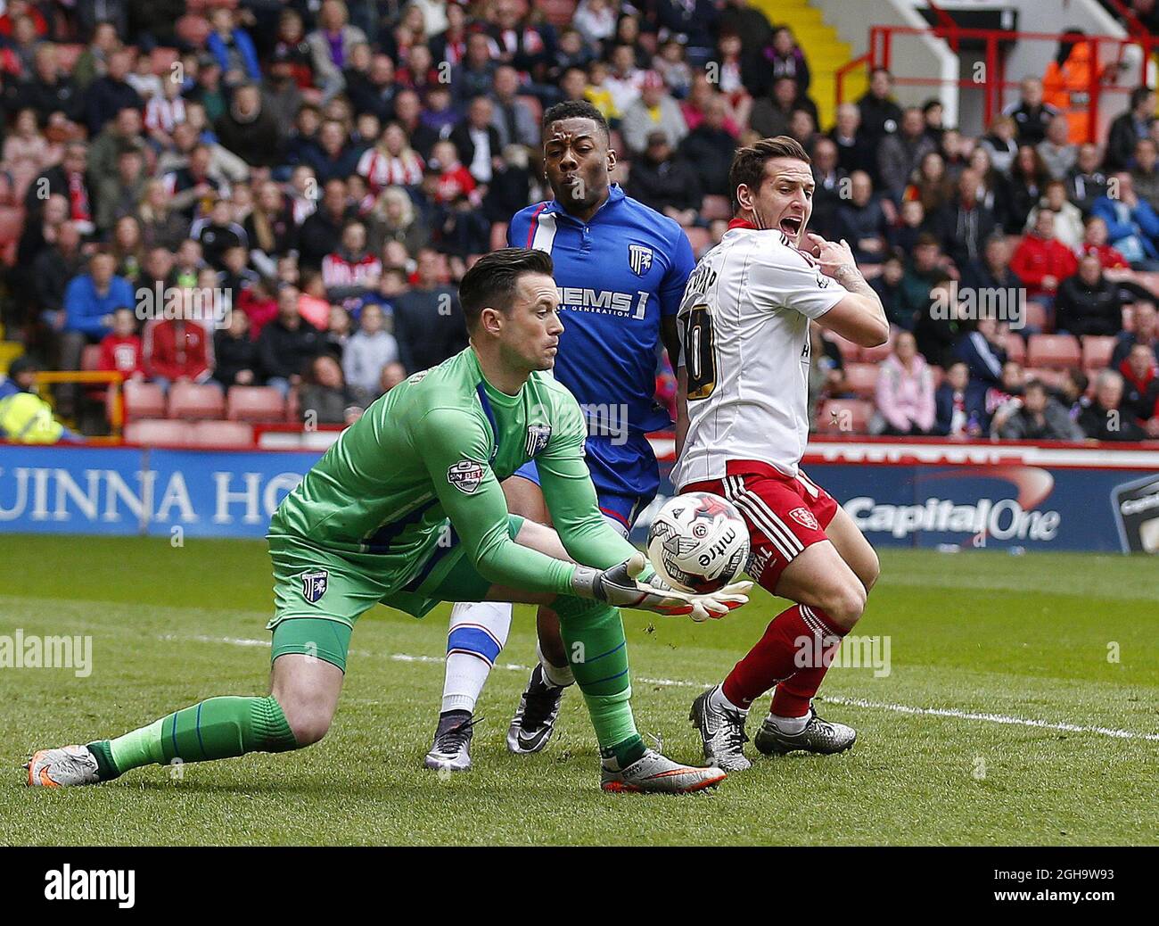 Stuart Nelson of Gillingham collects the ball as Billy Sharp of Sheffield Utd closes in during the Sky Bet League One match at The Bramall Lane Stadium.  Photo credit should read: Simon Bellis/Sportimage via PA Images Stock Photo