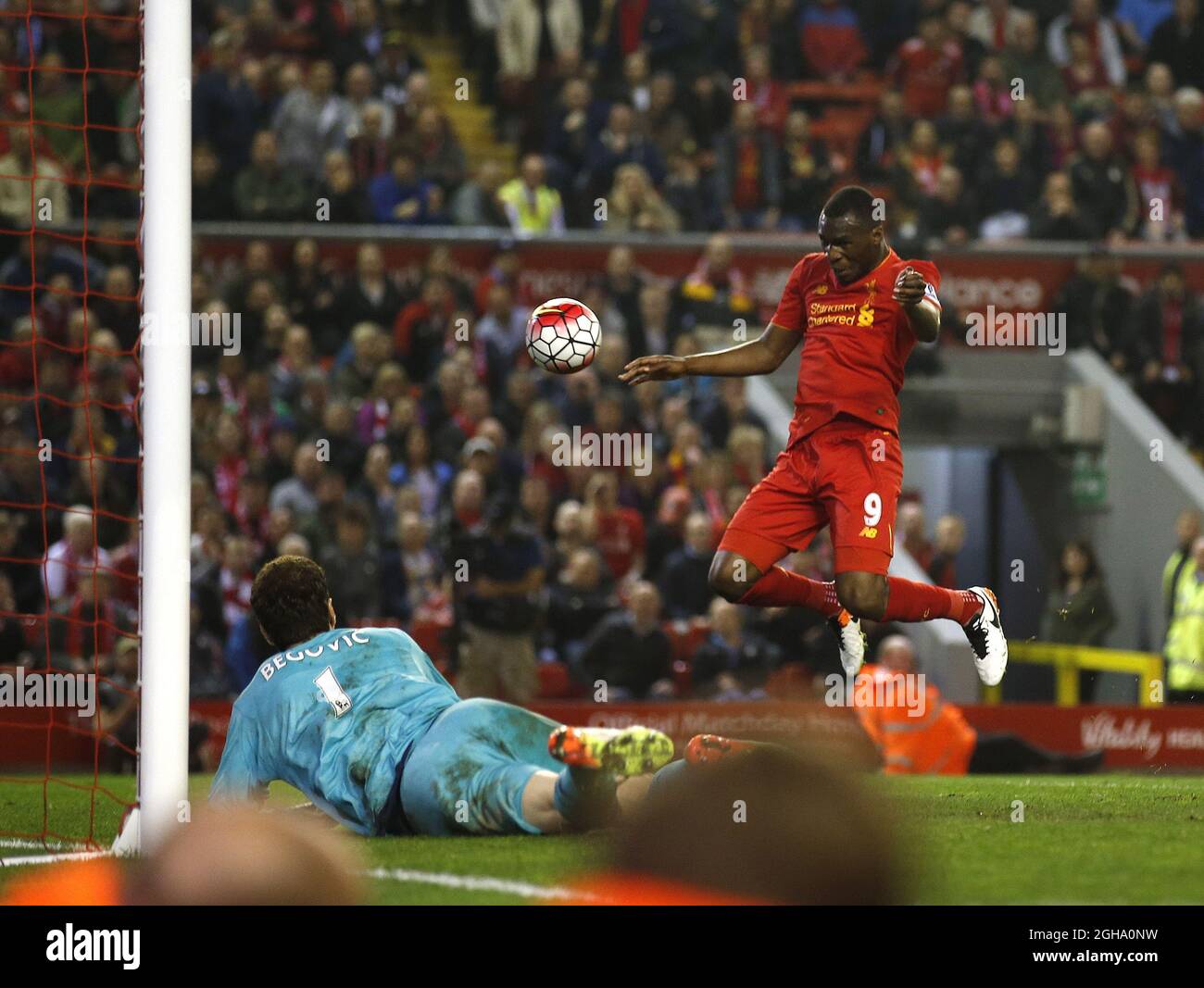 Christian Benteke of Liverpool  heads past Asmir Begovic of Chelsea to equalise on the night during the Barclays Premier League match at  Anfield Stadium, Liverpool. Photo credit should read: Simon Bellis/Sportimage via PA Images Stock Photo