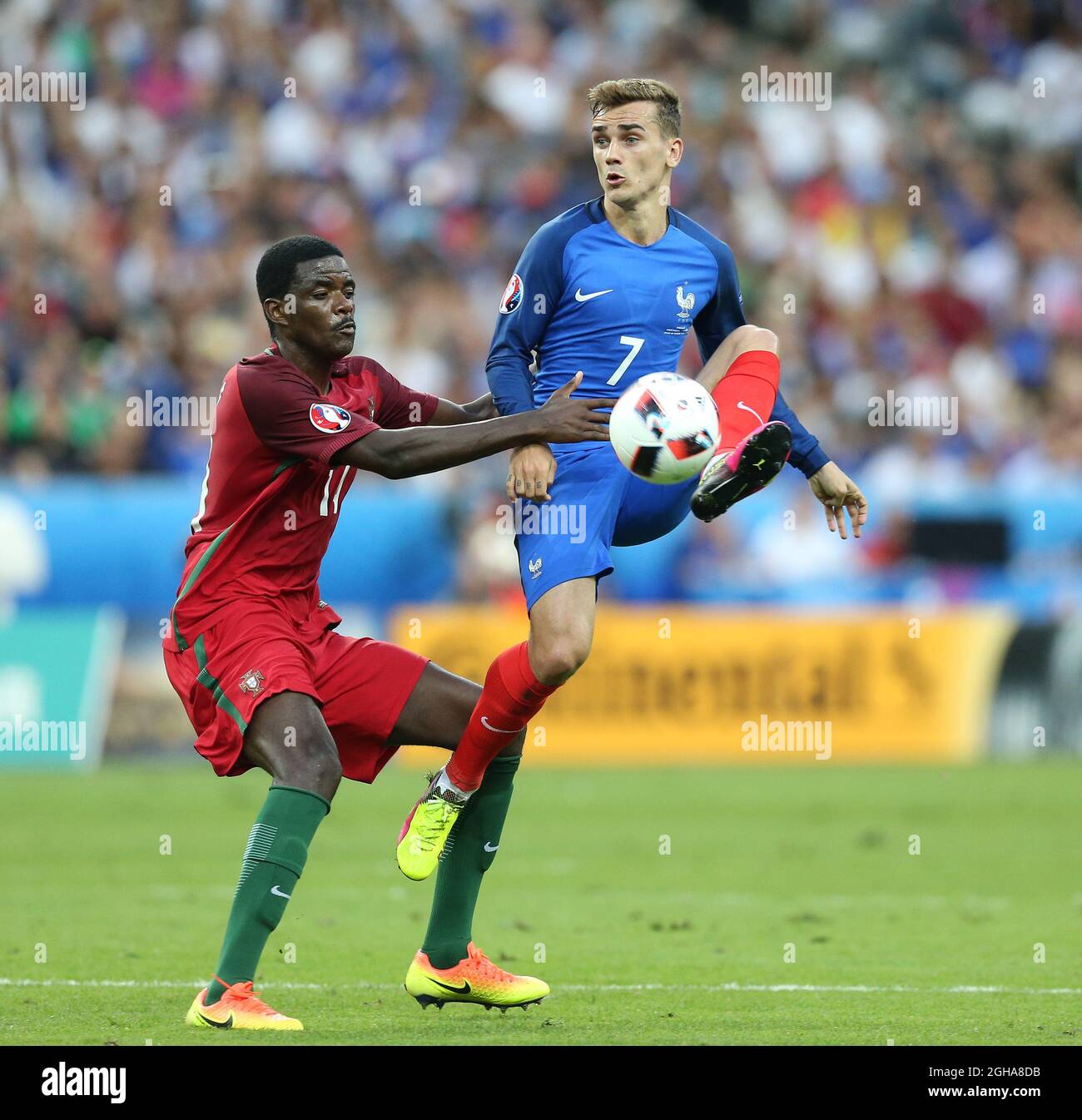 Antoine Griezmann of France tussles with William Carvalho of Portugal during the UEFA European Championship 2016 final match at the Stade de France, Paris. Picture date July 10th, 2016 Pic David Klein/Sportimage via PA Images Stock Photo