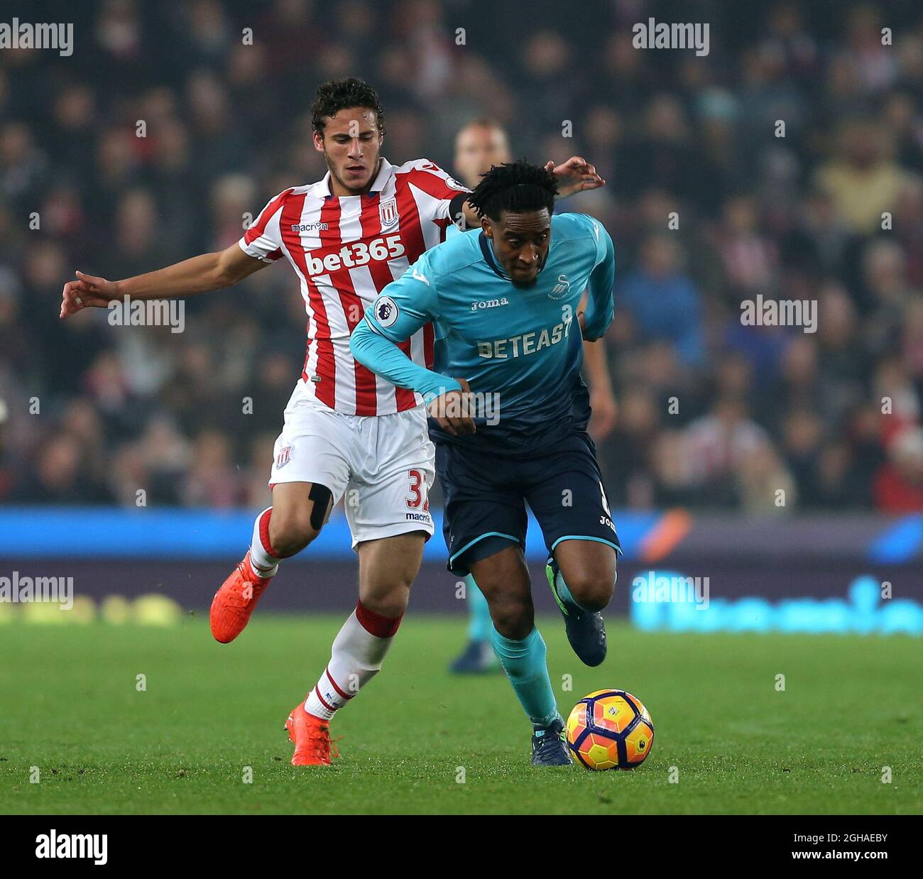 Ramadan Sobhi of Stoke City chases down Leroy Fer of Swansea City during the Premier League match at the Britannia Stadium, Stoke on Trent. Picture date: October 31st, 2016. Pic Simon Bellis/Sportimage via PA Images Stock Photo