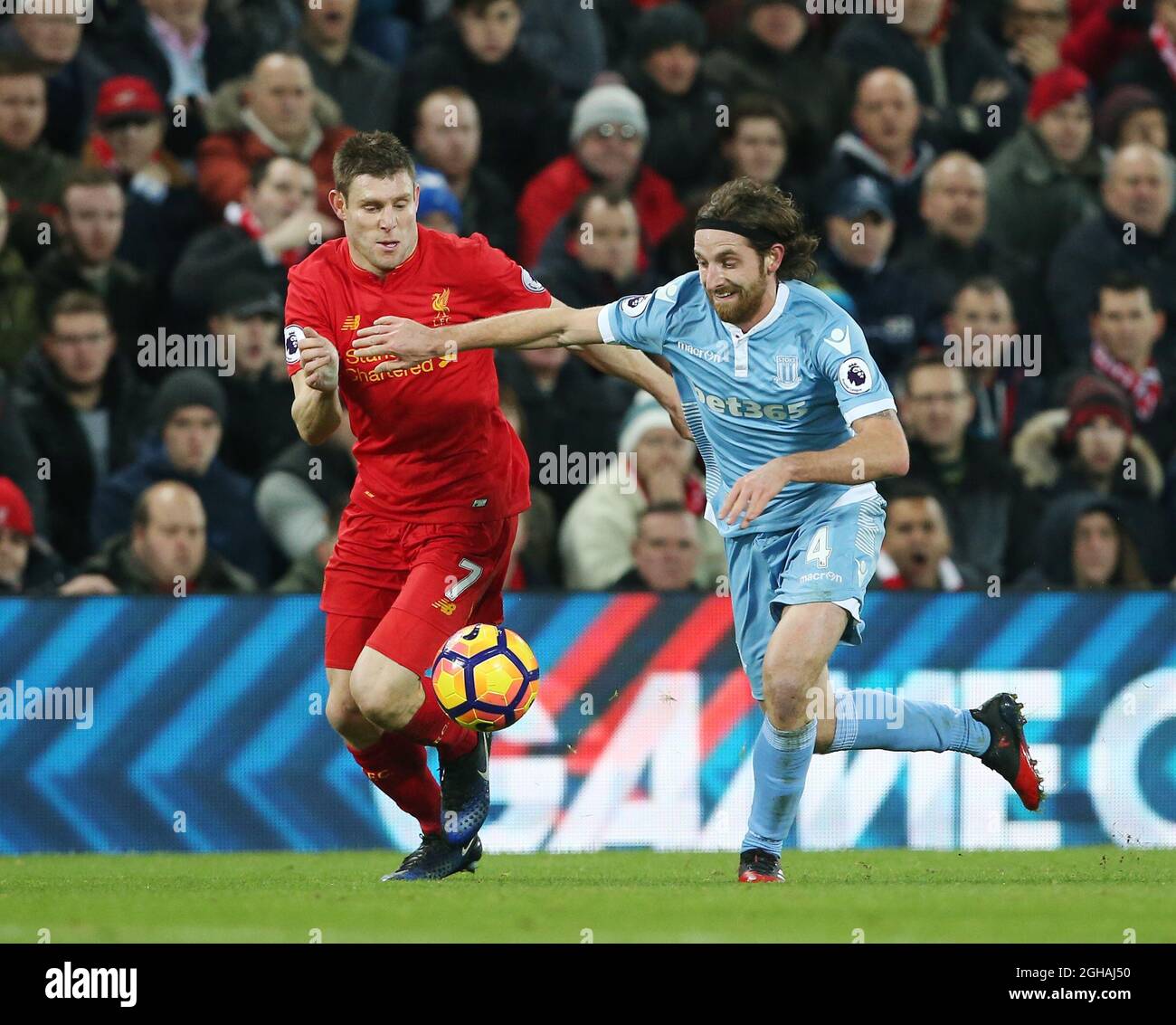 Liverpool's James Milner tussles with Stoke's Joe Allen during the ...