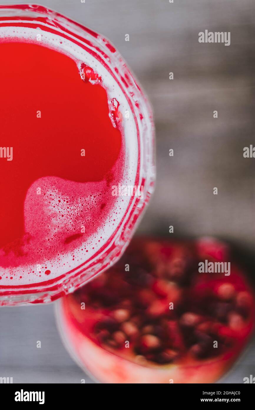 Top view of cocktail "Barbotage" made from grenadine syrup, orange juice and sparkling wine, and