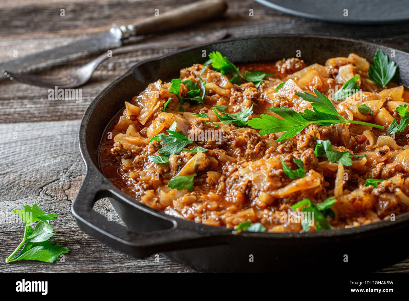 Stew with minced meat and cabbage in a cast iron pan Stock Photo Alamy