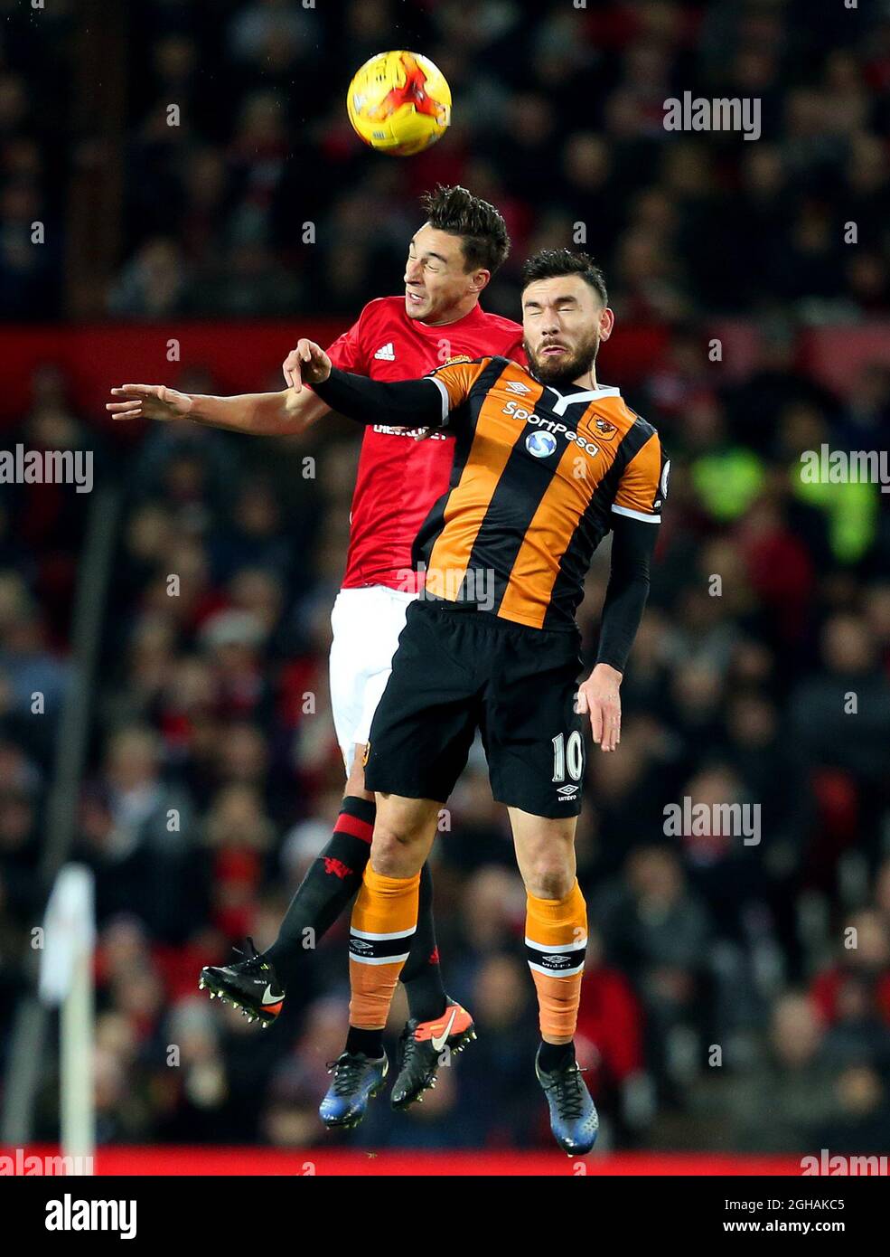 Robert Snodgrass of Hull City challenges Darmian of Manchester United during the EFL Cup semi final 1st Leg match at Old Trafford Stadium, Manchester. Picture date: January 10th, 2017. Pic credit should read: Matt McNulty/Sportimage via PA Images Stock Photo