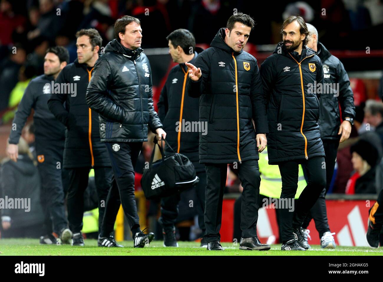 Hull City manager Marco Silva talks with his Assistant as they leave the pitch at full time during the EFL Cup semi final 1st Leg match at Old Trafford Stadium, Manchester. Picture date: January 10th, 2017. Pic credit should read: Matt McNulty/Sportimage via PA Images Stock Photo
