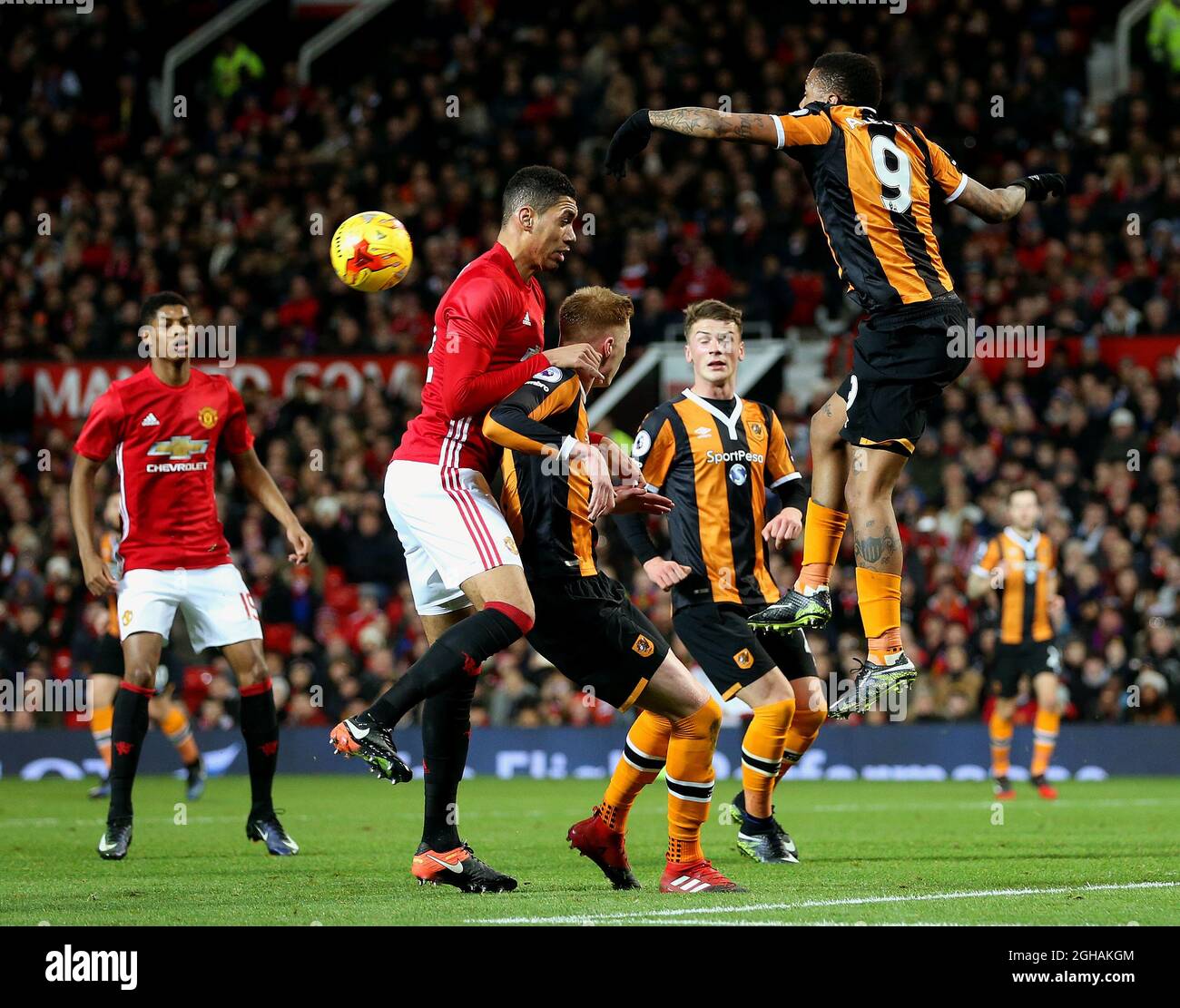 Chris Smalling of Manchester United challenges Abel Hernandez of Hull City during the EFL Cup semi final 1st Leg match at Old Trafford Stadium, Manchester. Picture date: January 10th, 2017. Pic credit should read: Matt McNulty/Sportimage via PA Images Stock Photo