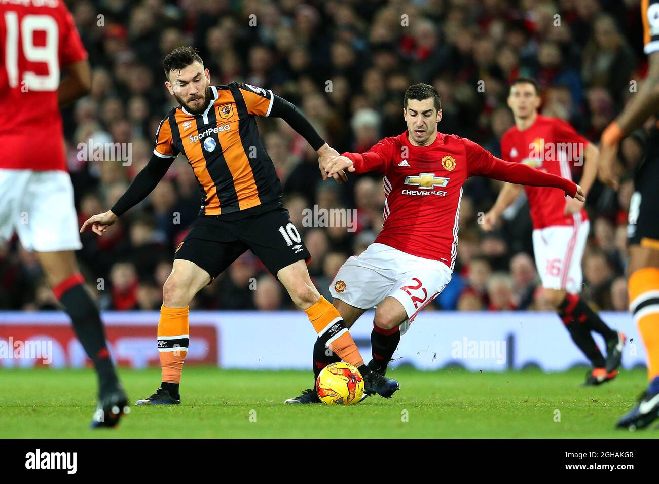 Henrikh Mkhitaryan of Manchester United challenges Robert Snodgrass of Hull City during the EFL Cup semi final 1st Leg match at Old Trafford Stadium, Manchester. Picture date: January 10th, 2017. Pic credit should read: Matt McNulty/Sportimage via PA Images Stock Photo
