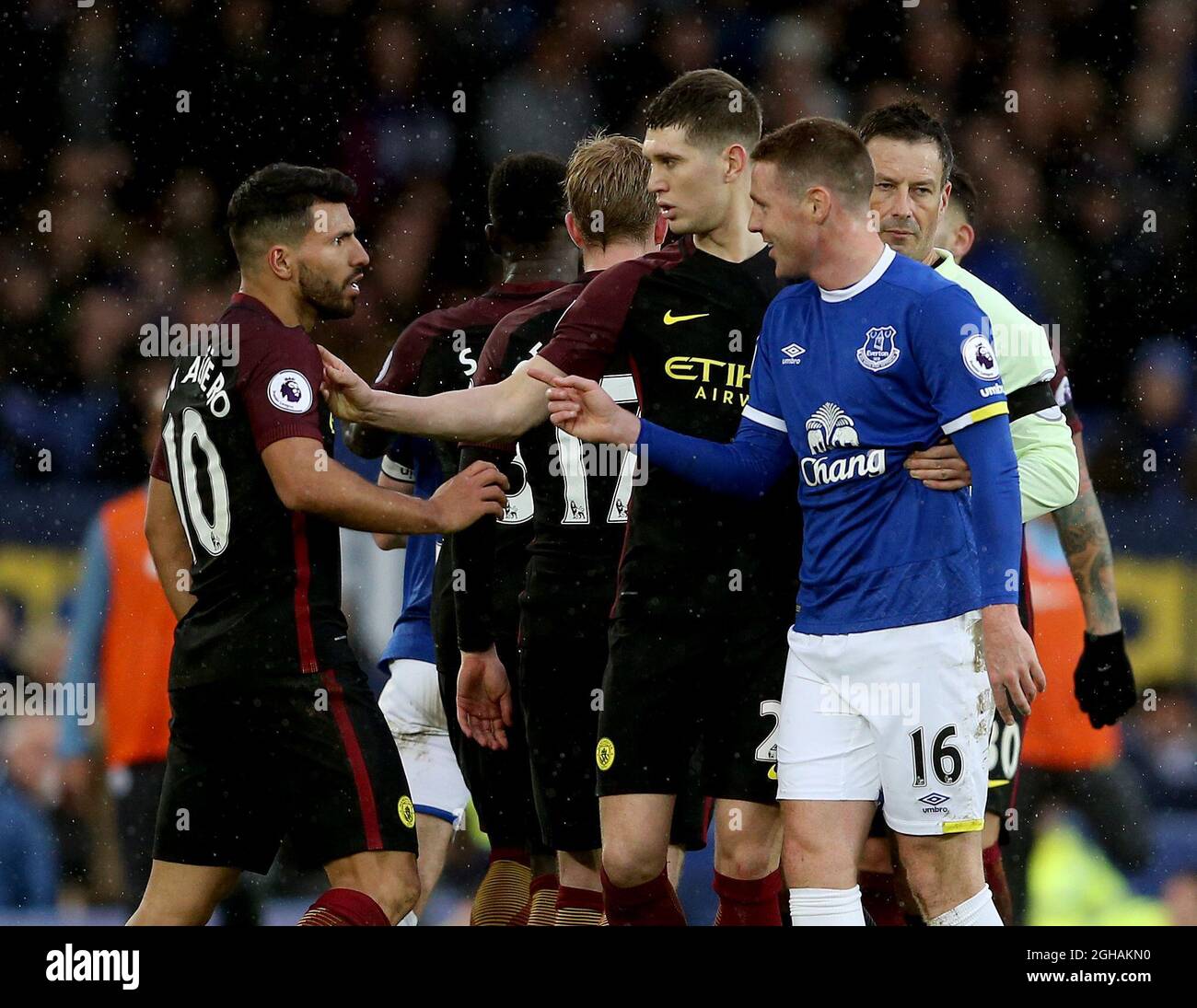 A frustrated Sergio Aguero of Manchester City picks a fight with James McCarthy of Everton during the English Premier League match at Goodison Park Stadium, Liverpool Picture date: January 15th, 2017. Pic Simon Bellis/Sportimage via PA Images Stock Photo