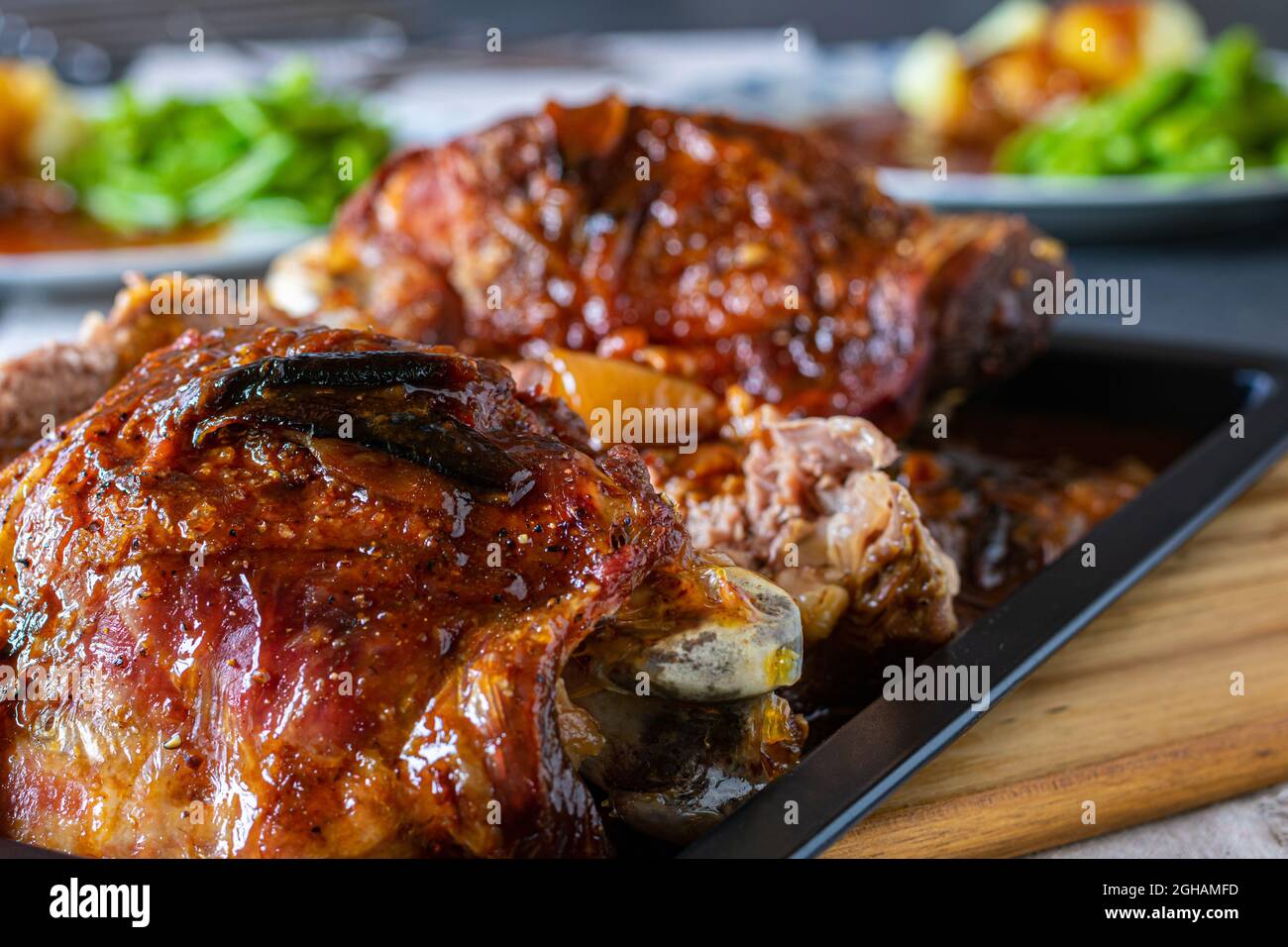 Roast Turkey legs or shanks on a table for dinner or lunch with blurred background. Closeup and front view Stock Photo