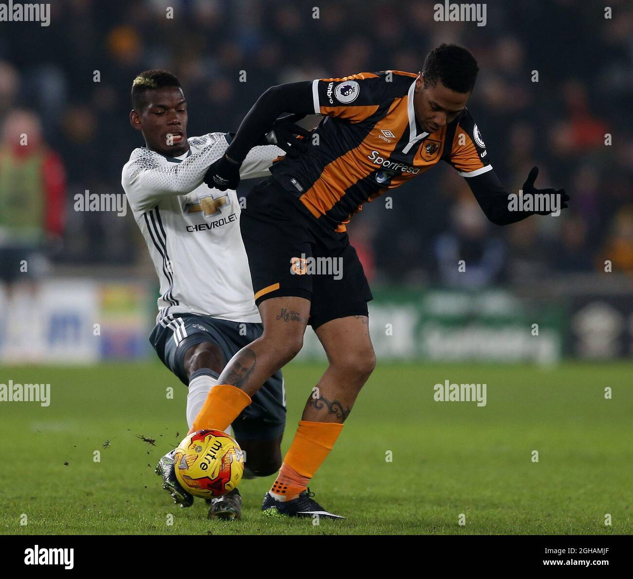Paul Pogba of Manchester United in action with Abel Hernandez of Hull City during the EFL Semi-Final 2nd Leg match at KCOM Stadium, Hull. Picture date: January 26th, 2017. Pic credit should read: Simon Bellis/Sportimage via PA Images Stock Photo