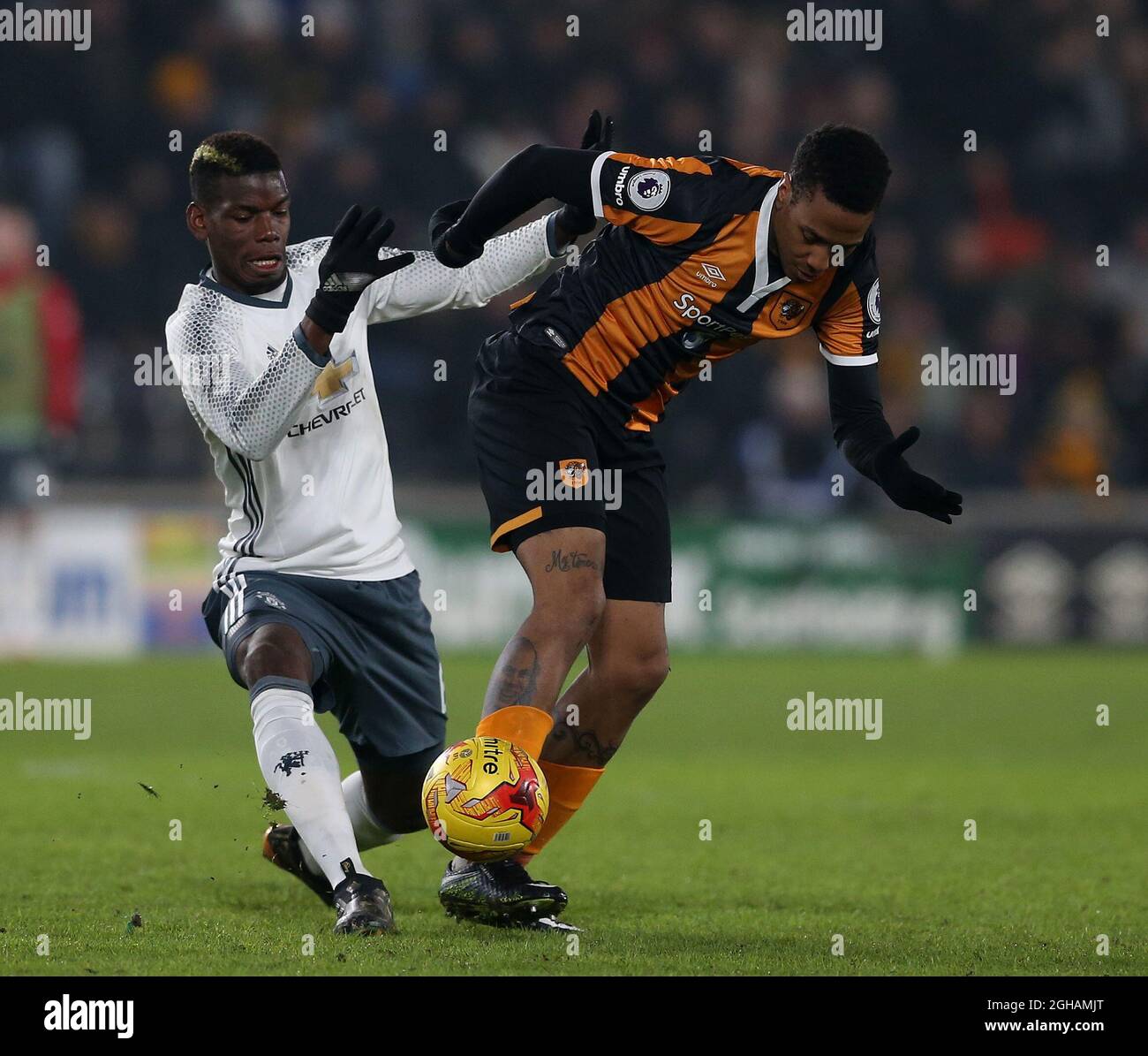 Paul Pogba of Manchester United in action with Abel Hernandez of Hull City during the EFL Semi-Final 2nd Leg match at KCOM Stadium, Hull. Picture date: January 26th, 2017. Pic credit should read: Simon Bellis/Sportimage via PA Images Stock Photo