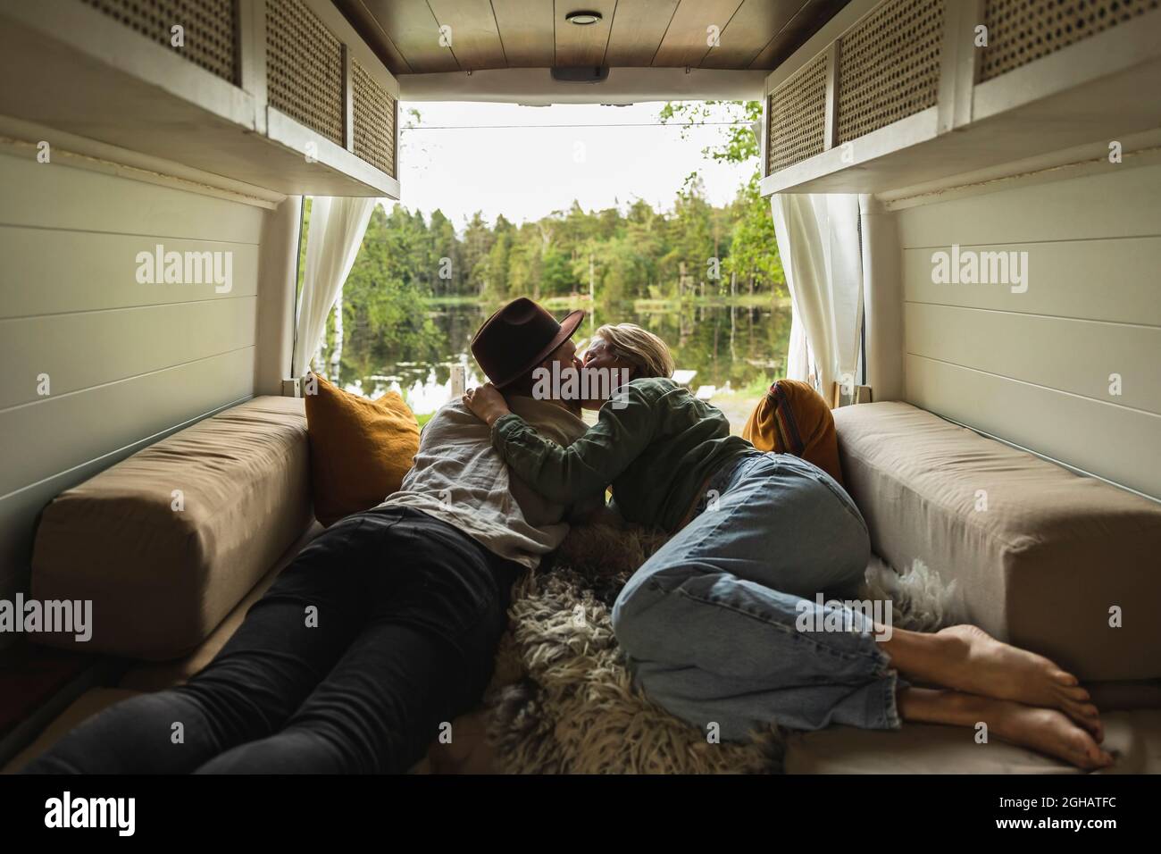 Romantic couple kissing in bed hi-res stock photography and images - Alamy