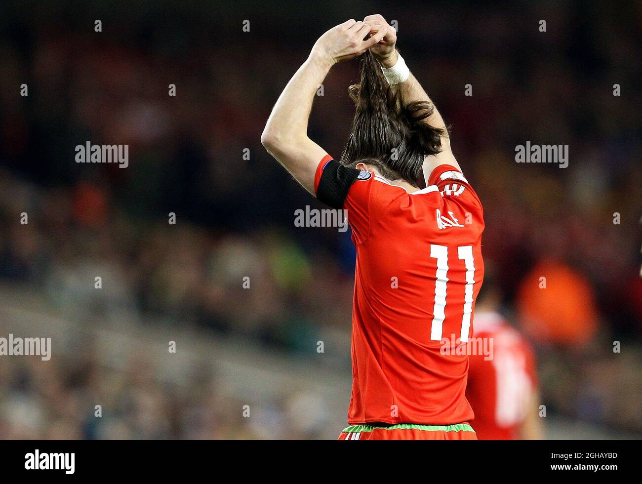 Gareth Bale of Wales unties his hair during the Group D World Cup Qualifier  at the Aviva Stadium, Dublin. Picture date: March 24th, 2017. Pic credit  should read: Matt McNulty/Sportimage via PA