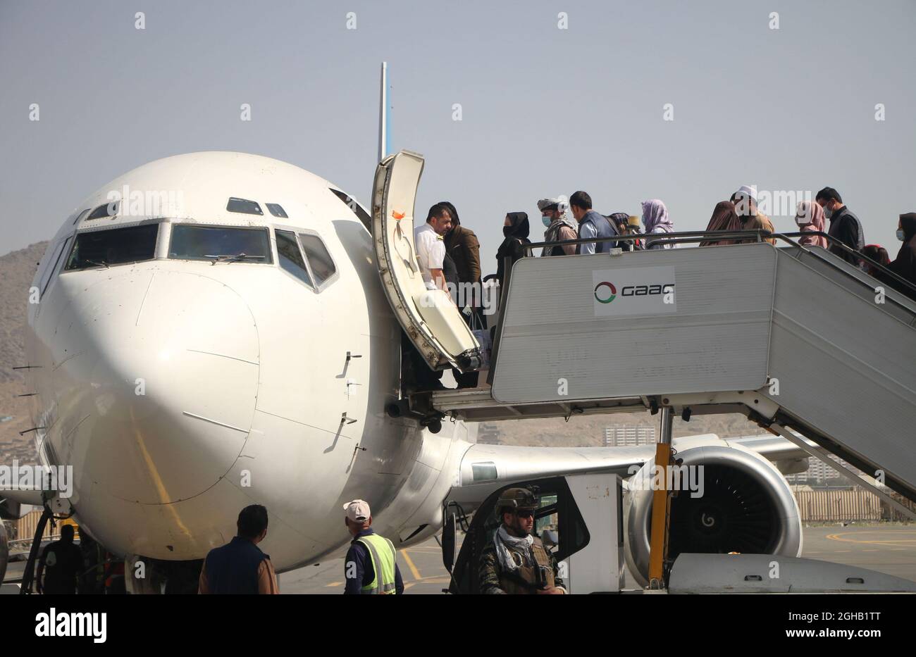 Kabul, Afghanistan. 6th Sep, 2021. Passengers board a plane at the airport in Kabul, capital of Afghanistan, Sept. 6, 2021. Afghanistan's flag carrier airline Ariana Afghan Airlines has resumed domestic flights, a local television channel reported Sunday. Credit: Saifurahman Safi/Xinhua/Alamy Live News Stock Photo