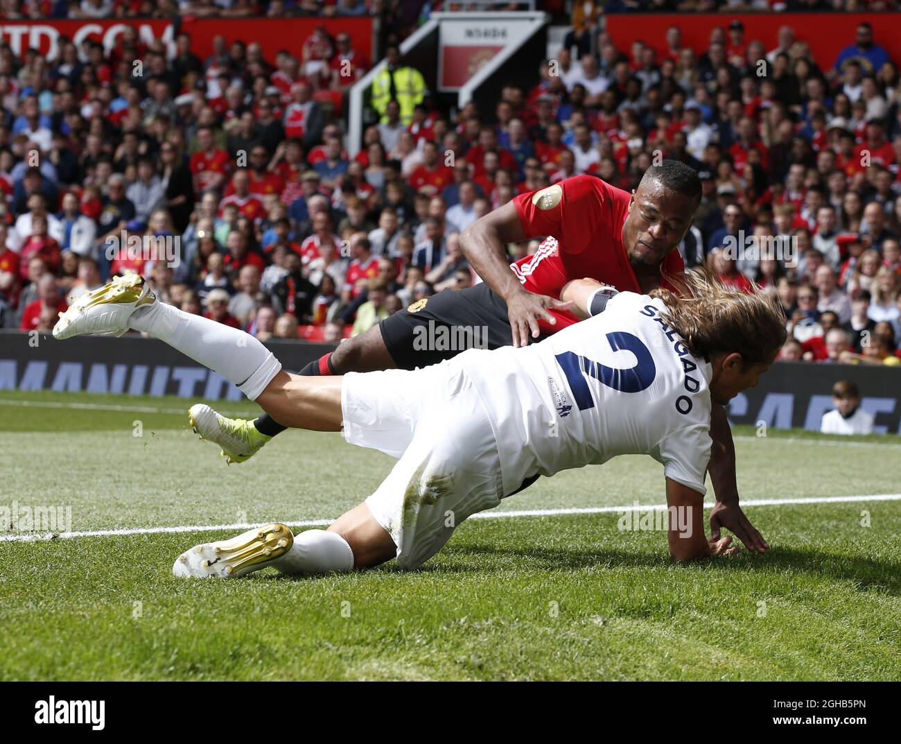 Michel Salgado and Patrice Evra fall down together during the Michael Carrick Testimonial match at the Old Trafford Stadium, Manchester. Picture date: June 4th 2017. Picture credit should read: Simon Bellis/Sportimage via PA Images Stock Photo
